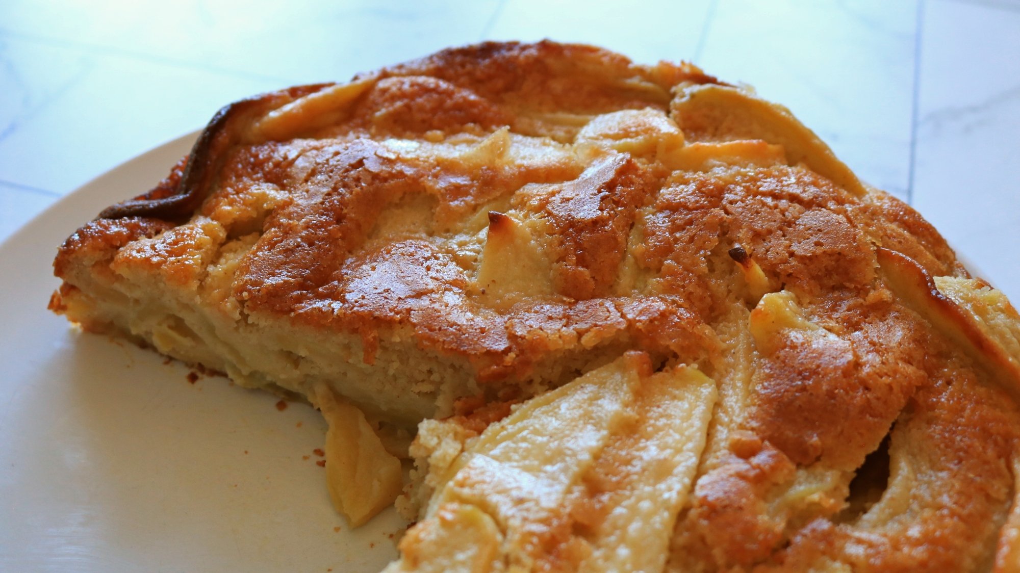 A French apple cake on a plate.